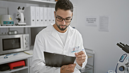 Sticker - A focused man in a lab coat examines documents in a modern laboratory setting, epitomizing medical professionalism.