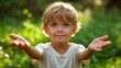 © OKAN - Little Boy Standing in Field With Outstretched Hands
