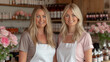 © OKAN - Two Women in Aprons Standing in Front of a Counter