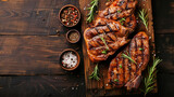 Fototapeta Mapy - Grilled pork steak with spices on dark background.