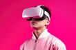© foto.katarinka - Portrait of young asian boy wearing virtual reality on pink background