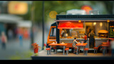 Fototapeta  - an open sided food truck with tables and people eating