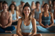 © MagnusCort - A woman sits in a lotus position in front of a group of people