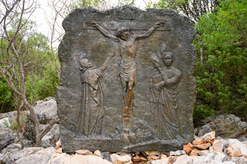 Wall Mural - The Crucifixion of Jesus – Fifth Sorrowful Mystery. A relief sculpture on Mount Podbrdo (the Hill of Apparitions) in Medjugorje.