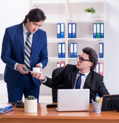 Wall Mural - Boss and his male assistant working in the office