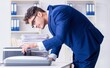 © Elnur - The businessman making copies in copying machine