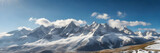 Fototapeta Góry - Snow-capped peaks illuminated by sunlight, presenting a magnificent natural landscape. 3:1 landscape banner and background style. Space for text. Suitable for website headers or background images.