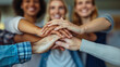 © Viktorikus - Happy mixed colleagues team people holding hands together. Business teamwork results are motivated by business success victory loyalty unity concept, group of people holding hands together