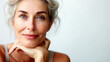 © PETR BABKIN - Portrait of a mature beautiful woman on a light background.
