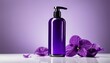 A bottle of lotion and purple flowers on a table