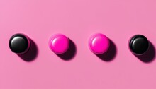 Four Pink Buttons With Black Tops
