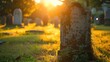 Sun setting behind a weathered gravestone in a tranquil cemetery