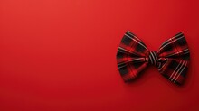 Fashionable Red And Black Plaid Bow Tie On A Vibrant Red Background
