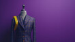 A bespoke double-breasted suit on a mannequin against a purple backdrop, exuding sartorial elegance with a measuring tape draped over the shoulders