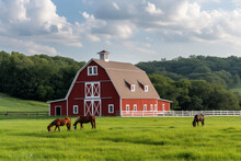 Classic Red Barn With Horses Grazing In Green Pasture