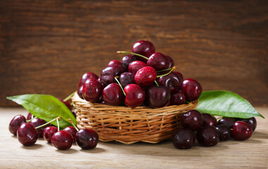 Wall Mural - bowl of fresh cherries on wooden background