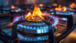 Close-up shot of blue fire from domestic kitchen stovetop. Gas cooker with burning flames of propane gas. Industrial resources and economy concept.
