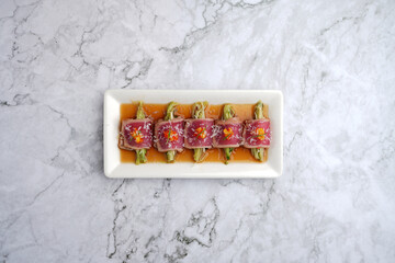 Wall Mural - Tuna appetizer with soy sauce. Japanese tiradito tuna, salmon