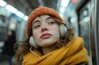 © lublubachka - Woman Wearing Headphones on a Subway