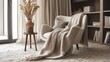 A luxurious cashmere throw over a modern chair, with a backdrop of sheer curtains and a vase of dried flowers, creating an inviting scene of home in a sophisticated interior design magazine.