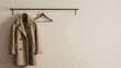 high-quality minimalist wool coat hung on a rack against a neutral background, embodying the concept of functional luxury, for an upscale fashion boutique's display or a style-focused editorial piece