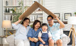 © Art_Photo - portrait enjoy happy smiling love asian family father and mother with young parents little asian girl sitting and making roof house with hands arms over head in new home