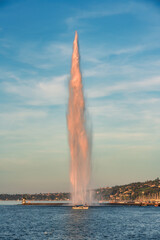 Wall Mural - The Jet d'Eau large fountain and tourist sightseeing on sailboat in Geneva, Switzerland