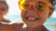 Happy young black child wearing sun glasses UV protection on summer vacation on the beach. AI generated
