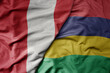 big waving national colorful flag of mauritius and national flag of peru .