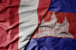 big waving national colorful flag of cambodia and national flag of peru .