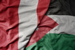 big waving national colorful flag of jordan and national flag of peru .