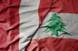 big waving national colorful flag of lebanon and national flag of peru .