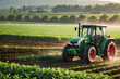 © CreativeMania - Agricultural landscape with green tractor sowing crops and plowing agricultural field. Tractor working on farm, sustainable farming