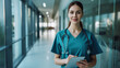 © Studio Nova - confident young female healthcare worker in blue scrubs with a stethoscope around her neck
