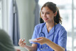 © amnaj - Nurse is explaining medication to a patient.