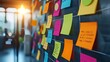 Colorful sticky notes on a blackboard for brainstorming and project planning in an office