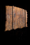 Fototapeta Big Ben - Door with stark shadow,  Minerve village in the Hérault department, Occitanie, France