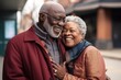 © Larysa - Happy black man hugging his wife on city street