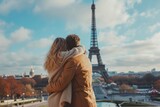 Fototapeta Paryż - Back view of young couple standing in front of Eiffel Tower in Paris