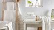 White bathroom interior with towels and appliances.