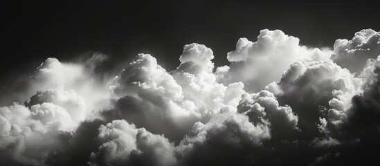 Wall Mural - Ethereal Monochrome: White Clouds Drift Across the Dark Sky in a Stunning Display of Monochrome Beauty