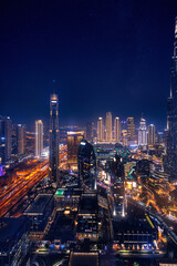 Wall Mural - Modern downtown United Arab Emirates. Dubai night amazing skyline cityscape with illuminated skyscrapers, Aerial top view