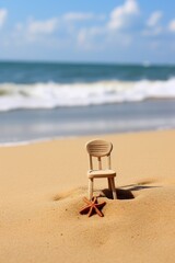 Poster - yellow plastic chair on the beach sand