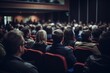 © Oleg Kozlovskiy - A focused audience sits in a conference hall, attentively looking towards the stage, capturing the essence of a professional gathering or seminar