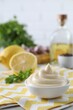 Leinwandbild Motiv Tasty mayonnaise sauce in bowl on table. Space for text