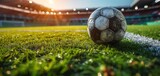 Fototapeta Sport - After game. Closeup soccer ball on grass of football field at crowded stadium
