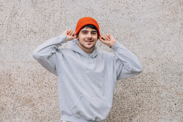 Poster - young man with hat on the street wall