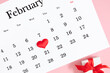 © prime1001 - Valentine's Day background. Date February 14 on calendar 2024. Gift box and valentine hearts. Valentines day concept. Flat lay, top view, copy space
