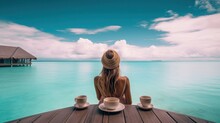 Luxury lifestyle elegant bikini woman drinking coffee cup by infinity swimming pool at overwater bungalow overlooking turquoise pristine ocean