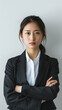 © Lin_Studio - a japanese businesswoman posing with her arms crossed